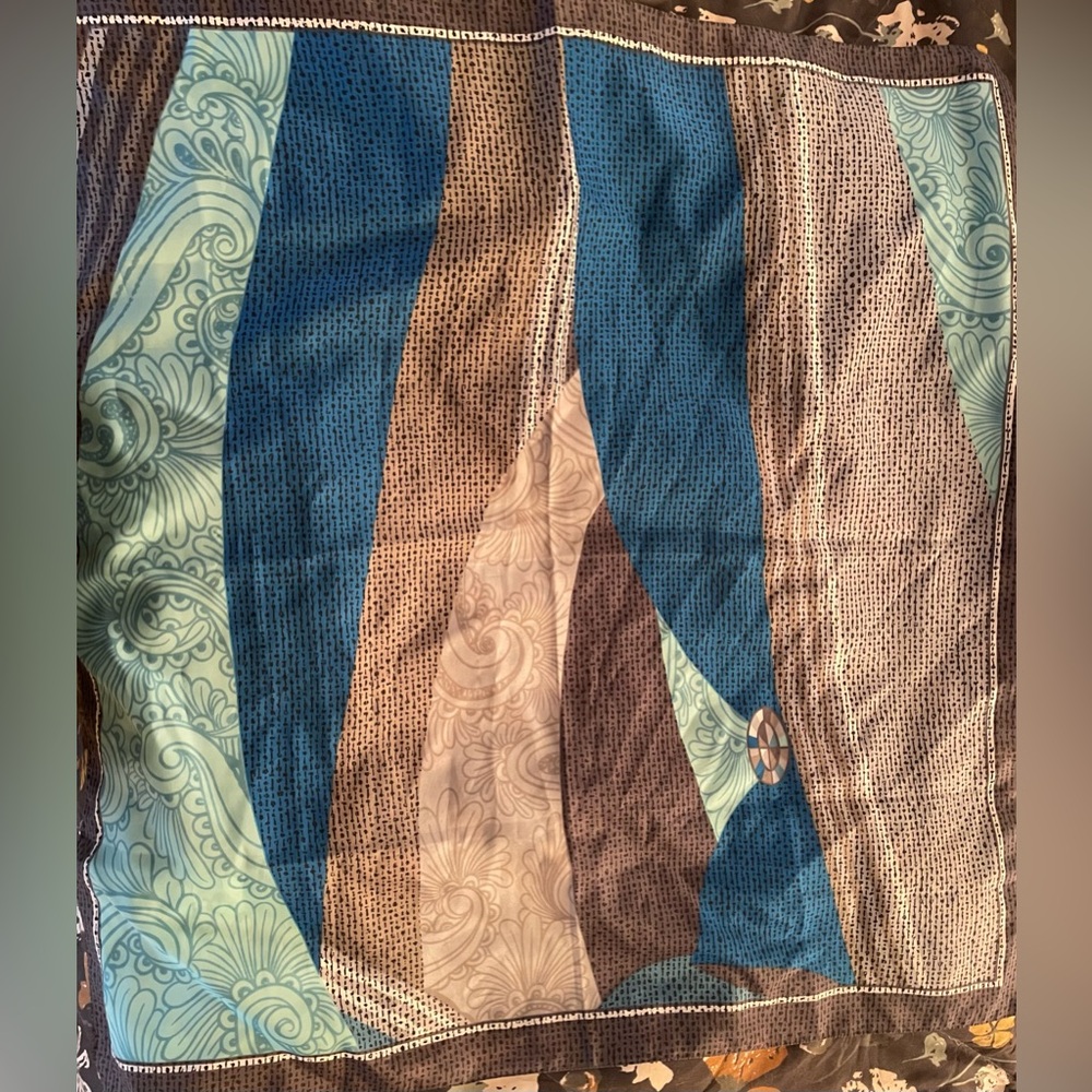 Women’s multicolor scarf. Blue/mint/brown/tan/gray. 100% polyester. 31” X 31”.